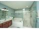 This is a bathroom with a glass-enclosed shower, soaking tub, and double sink vanity at 104 S Ansel Xing, Goose Creek, SC 29445