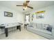 Bright bedroom features a ceiling fan, sofa, and an air hockey table for entertainment at 104 S Ansel Xing, Goose Creek, SC 29445