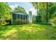 Well-maintained house with a screened porch surrounded by verdant trees at 104 S Ansel Xing, Goose Creek, SC 29445