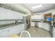 Open kitchen design boasts white cabinetry, stainless appliances, granite countertops, and ample storage space at 104 S Ansel Xing, Goose Creek, SC 29445