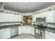 Renovated kitchen featuring granite countertops, stainless steel appliances, and convenient layout at 104 S Ansel Xing, Goose Creek, SC 29445