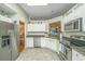 Well-lit kitchen featuring granite countertops, stainless steel appliances, and ample cabinet space for storage at 104 S Ansel Xing, Goose Creek, SC 29445