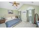 Vaulted ceiling main bedroom featuring an upholstered headboard, ceiling fan and neutral color palette at 104 S Ansel Xing, Goose Creek, SC 29445