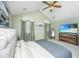 Serene main bedroom with vaulted ceilings, soft lighting, and elegant furnishings create a tranquil retreat at 104 S Ansel Xing, Goose Creek, SC 29445