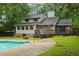 Spacious backyard with a refreshing in-ground pool, multilevel deck, and attractive two-story home in a wooded setting at 105 Londonderry Rd, Goose Creek, SC 29445