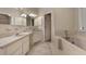 Bright bathroom with double sinks, vanity, and tiled tub at 105 Londonderry Rd, Goose Creek, SC 29445