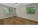 Bedroom with two windows and beautiful wood laminate flooring at 105 Londonderry Rd, Goose Creek, SC 29445