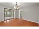 Open dining room with hardwood floors and sliding glass doors to the patio at 105 Londonderry Rd, Goose Creek, SC 29445