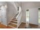 Bright foyer features hardwood floors and white accents with a staircase leading upstairs at 105 Londonderry Rd, Goose Creek, SC 29445