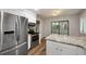 Bright kitchen with stainless steel appliances and island with granite countertops at 105 Londonderry Rd, Goose Creek, SC 29445
