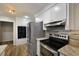 A modern kitchen features granite countertops and stainless steel appliances at 105 Londonderry Rd, Goose Creek, SC 29445