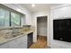 A kitchen features white cabinets, modern appliances, and granite countertops at 105 Londonderry Rd, Goose Creek, SC 29445