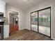 Open living room with wooden floors and glass doors that offer view into another room at 105 Londonderry Rd, Goose Creek, SC 29445