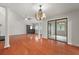 Open-concept living space with hardwood floors and sliding glass doors at 105 Londonderry Rd, Goose Creek, SC 29445