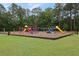 Community playground with swings, slides, and climbing structures, offering a fun and safe environment for children to play at 105 Londonderry Rd, Goose Creek, SC 29445