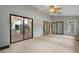Sunroom boasts tile floor, multiple glass doors, and a view into the kitchen at 105 Londonderry Rd, Goose Creek, SC 29445