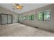Relax in sunroom with tiled floors, lots of windows, and glass door at 105 Londonderry Rd, Goose Creek, SC 29445