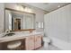 Bathroom with a pink vanity, elegant stool, and shower with a decorative curtain at 1054 Bennington Dr, Charleston, SC 29492