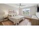 Bright bedroom with a queen bed, stylish decor, and a large window overlooking the neighborhood at 1054 Bennington Dr, Charleston, SC 29492