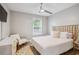 Bedroom featuring a window, a ceiling fan, and stylish furniture at 1054 Bennington Dr, Charleston, SC 29492