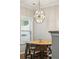 Bright dining area featuring a modern chandelier and natural light at 1054 Bennington Dr, Charleston, SC 29492