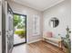 Inviting entryway with wood floors, bench, and open door at 1054 Bennington Dr, Charleston, SC 29492