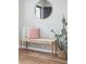 Bench with a round mirror and cactus detail in entryway at 1054 Bennington Dr, Charleston, SC 29492