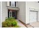 A well maintained front entrance with garage access and a walkway to the front door at 1054 Bennington Dr, Charleston, SC 29492