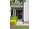 Covered front porch with brick detail and lovely flower basket at 1054 Bennington Dr, Charleston, SC 29492