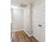 Hallway area with wood floors and a double door closet and modern lighting at 1054 Bennington Dr, Charleston, SC 29492