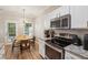 Modern kitchen area leading to the dining area with updated appliances at 1054 Bennington Dr, Charleston, SC 29492