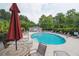Community pool surrounded by trees and ample seating areas at 1054 Bennington Dr, Charleston, SC 29492