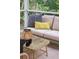 Close-up on the screened porch furniture, the coffee table, and the greenery beyond at 1054 Bennington Dr, Charleston, SC 29492