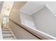 Staircase featuring neutral walls, a decorative chandelier, and wood and white railings at 1054 Bennington Dr, Charleston, SC 29492