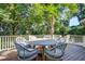 Well-maintained back deck with shade featuring outdoor dining set at 1081 Groves Manor Ct, Mount Pleasant, SC 29464