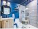 Modern bathroom with a walk-in shower, vanity, and striking navy blue walls at 1081 Groves Manor Ct, Mount Pleasant, SC 29464