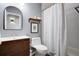 Bathroom featuring a vanity sink with wood detailing, a toilet, and shower with a white patterned shower curtain at 1081 Groves Manor Ct, Mount Pleasant, SC 29464