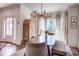 Bright dining room featuring modern lighting, a wooden table, and a view to the home's entrance at 1081 Groves Manor Ct, Mount Pleasant, SC 29464