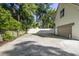 Spacious driveway with a large garage and lush landscaping provides ample parking at 1081 Groves Manor Ct, Mount Pleasant, SC 29464