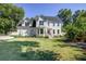 Beautiful two-story house with green lawn, bay window, and manicured landscaping at 1081 Groves Manor Ct, Mount Pleasant, SC 29464