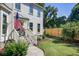 Inviting front entry with decorative door, and manicured landscaping at 1081 Groves Manor Ct, Mount Pleasant, SC 29464