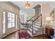 Elegant foyer with hardwood floors, stairs, and abundant natural light at 1081 Groves Manor Ct, Mount Pleasant, SC 29464