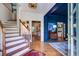 Welcoming foyer featuring hardwood floors, staircase, and stylish decor at 1081 Groves Manor Ct, Mount Pleasant, SC 29464