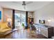 Bright home office with hardwood floors, modern desk, decor, and natural light from large window at 1081 Groves Manor Ct, Mount Pleasant, SC 29464