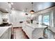 Gourmet kitchen with marble countertops, custom cabinets, stainless steel appliances, and a casual dining area at 1081 Groves Manor Ct, Mount Pleasant, SC 29464