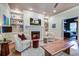 Comfortable living room with a cozy fireplace, built-in shelves, and hardwood floors at 1081 Groves Manor Ct, Mount Pleasant, SC 29464