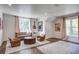 Comfortable living room with leather sofa, accent chairs, rug, and natural light at 1081 Groves Manor Ct, Mount Pleasant, SC 29464