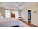 Well-lit main bedroom featuring a comfortable bed, modern furnishings, and access to an organized closet at 1081 Groves Manor Ct, Mount Pleasant, SC 29464
