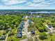 Aerial view of a new neighborhood by the water surrounded by lush trees at 1095 Saltwater Cir, Johns Island, SC 29455