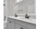 Bright bathroom features double sink vanity with black hardware, a large mirror, and tiled shower at 1095 Saltwater Cir, Johns Island, SC 29455